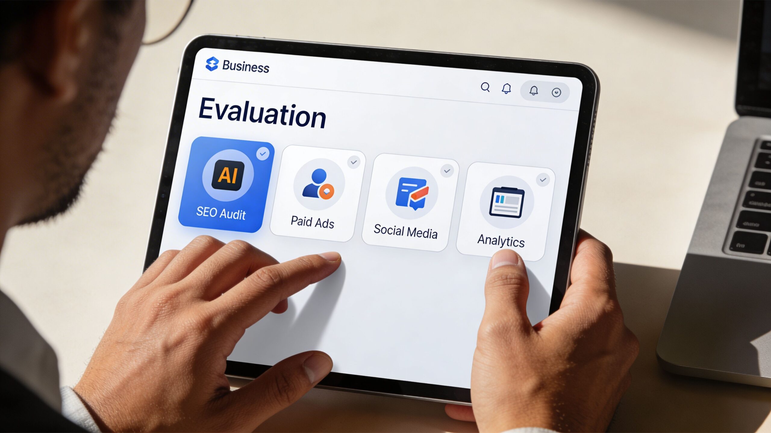 A professional analyzing digital marketing services including SEO audit and paid ads on a tablet screen.
