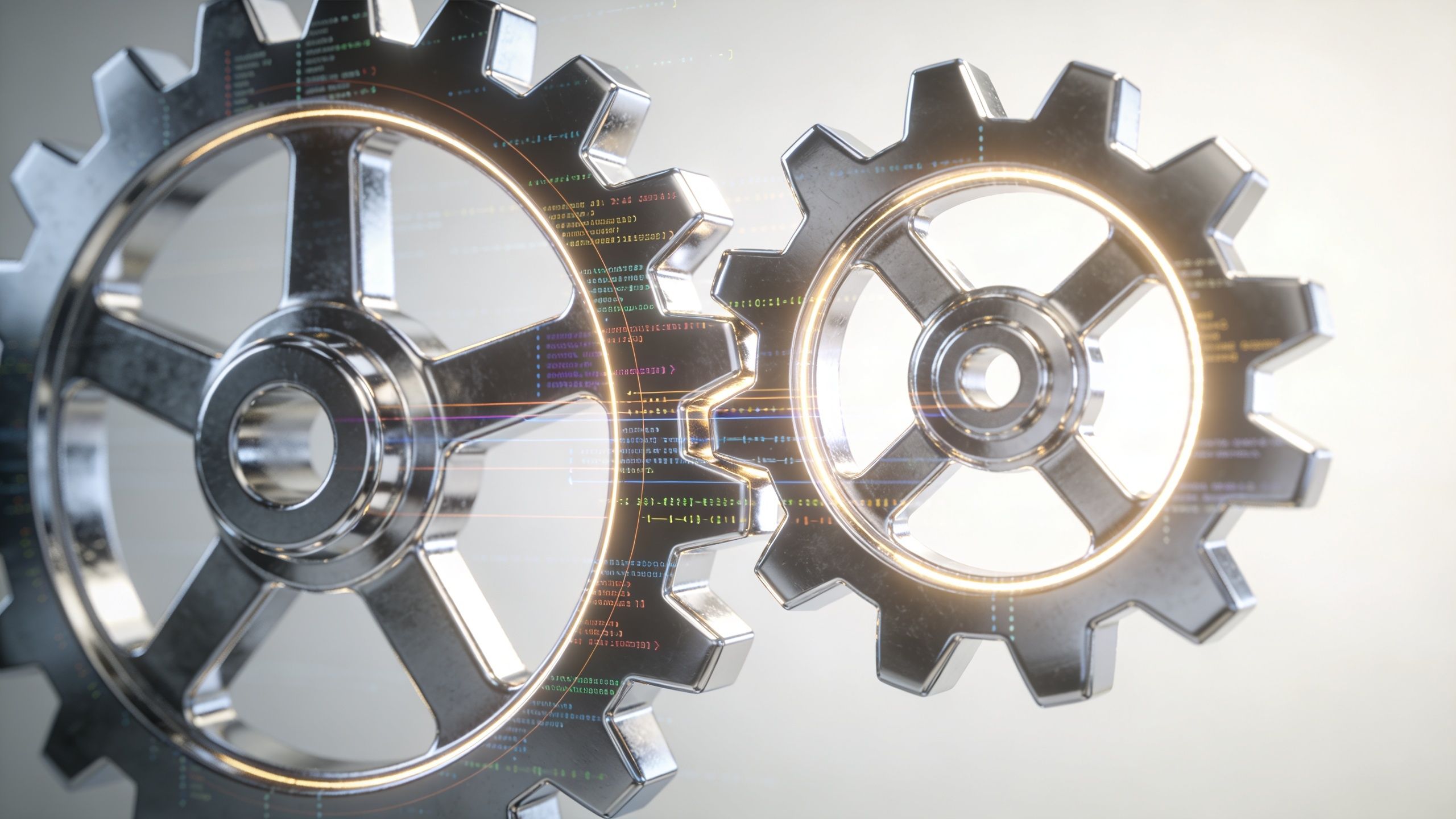Two interlocking metallic gears with digital coding overlays representing technology, strategy, and business automation.