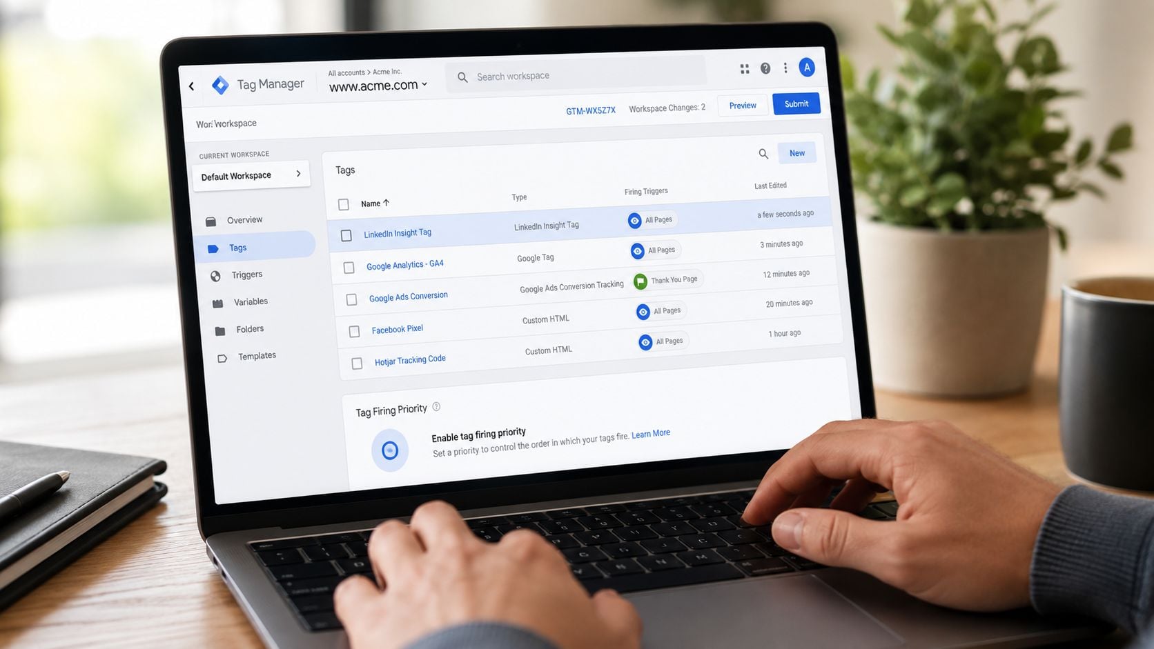 A professional using a laptop to configure marketing tags in the Google Tag Manager dashboard interface.