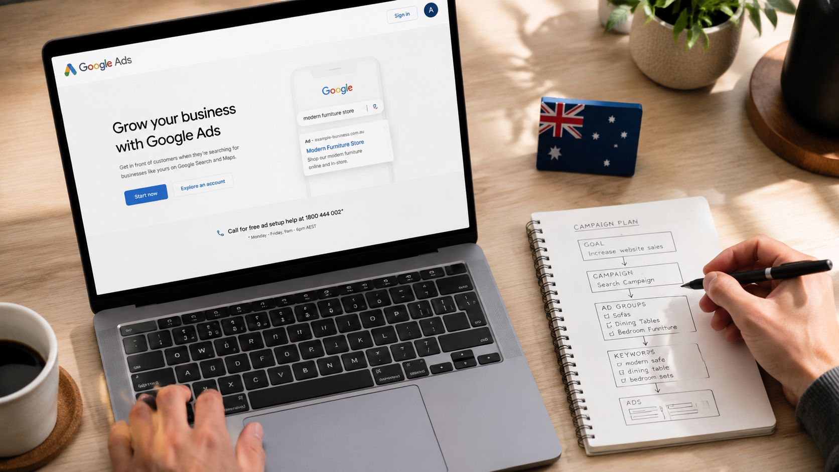 A person planning a Google Ads campaign in a notebook while looking at the Google Ads website.